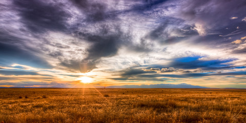 Magnificent sunset over an open field in the countryside. 