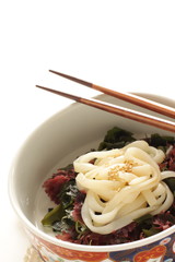 Japanese food, seaweed and agar salad on Kishimen udon noodles