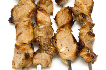 roast the meat pieces kebab on stick , close-up