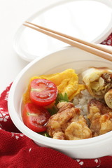 homemade spring roll and fried chicken on rice bento 