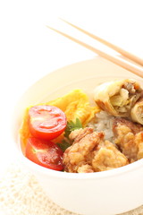 homemade spring roll and fried chicken on rice bento 