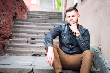 portrait of a Young man in a shirt and trousers