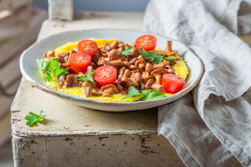 Homemade and tasty omelette made of fresh chanterelles mushrooms