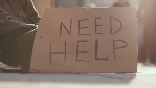 Close up sign homeless honeliness social cardboard homeless beggar face poverty poor hungry dirty unemployed despair male portrait