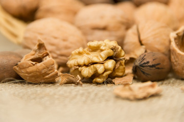 variety of healthy nuts on rustic background
