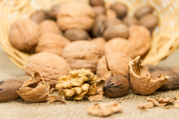 variety of healthy nuts on rustic background