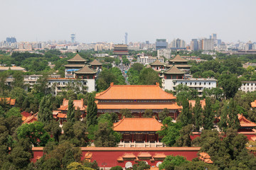 Fototapeta na wymiar City landscape. Drum tower at the end of the road. On the horizon is the Olympic tower and the building of IBM. View of the northern part of the capital of China from the park.