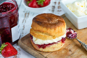 Traditional English scones with strawberry jam and clotted cream