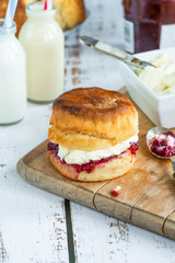 Traditional English scones with strawberry jam and clotted cream