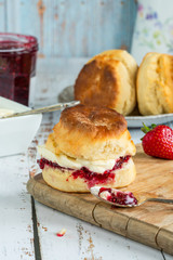 Traditional English scones with strawberry jam and clotted cream