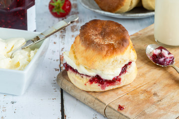 Traditional English scones with strawberry jam and clotted cream