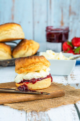 Traditional English scones with strawberry jam and clotted cream