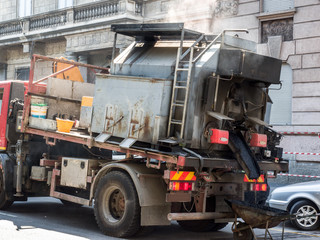 truck used for the repair of the road surface.Milan, Italy