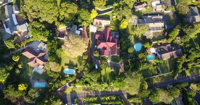 Aerial drone footage of a mid income residential area in a green city