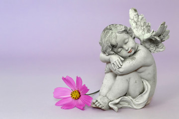 Guardian angel sleeping. Angel and flower