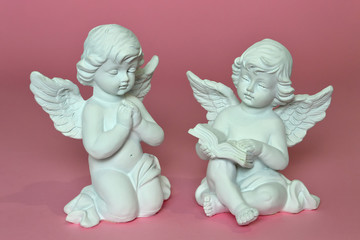 Little angels on pink background