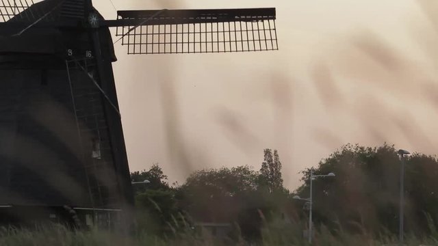 Slhouette of a classic windmill in the sunset.