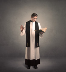 young priest in giving his blessing