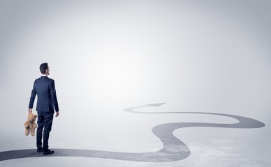 Fototapeta premium Man with object in his hand on the direct way to success