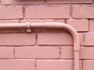 brick wall with a pipe