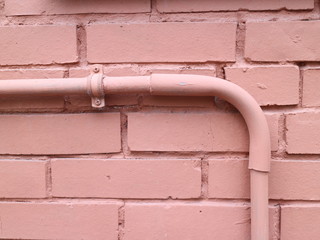 brick wall with a pipe