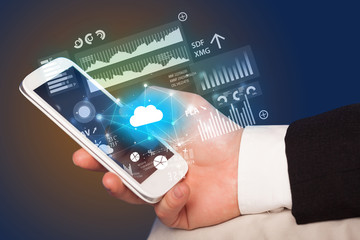 Hand using phone with cloud technology and linked information concept