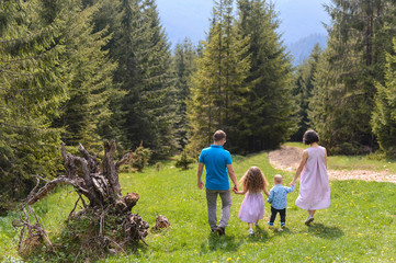 Fototapeta premium Family Walking Away to Forest