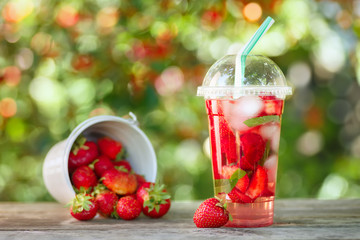 strawberry lemonade in plastic glass