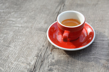 Morning espresso red cup cooffee on wooden table