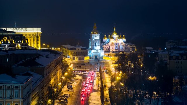 Kyiv, Ukraine. A video of night in Kyiv, Ukraine, with a view of the St Michaels Golden - Domed Monastery and traffic on a winter day with a dark sky. Time-lapse at sunset with illumination