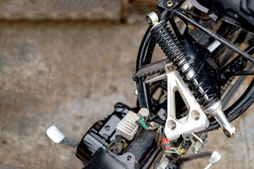 Fototapeta premium motorcycle repair with soft-focus and over light in the background