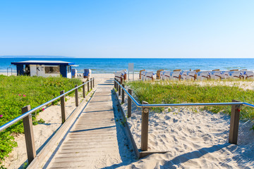 Path to beach with traditional wicker chairs in Binz summer resort, Ruegen island, Baltic Sea, Germany