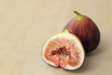 Fresh fruits, figs (Ficus carica) on the wooden plate.