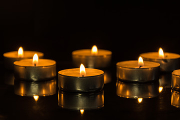 Light of candle flame. Romantic holiday candles burning .