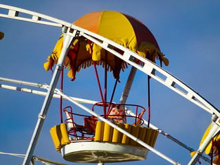 Ferris wheel on sky background
