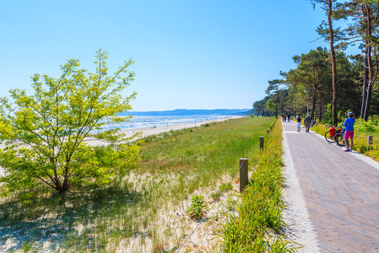 Walking path along sandy beach in Prora town, Ruegen island, Baltic Sea, Germany