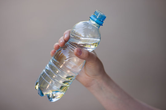 Water bottle in hand 