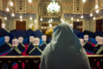 Woman in Sultan Ahmed Tomb in Istanbul, Turkey.