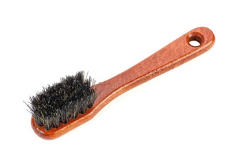 Wooden brush for footwear on a white background