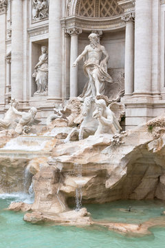 Side view of the statues of the Trevi Fountain in Rome. Vertically.