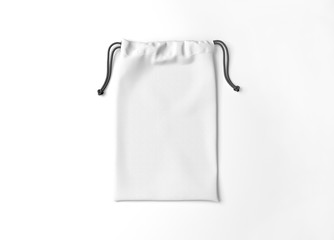White drawstring bag on background. Fabric cotton small bag. Isolated pouch.