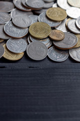 Thai money on black wood table with soft-focus and over light in the background 