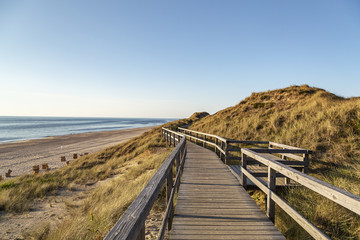 Evening at Wooden promenade with View to Kampen Beach at Sylt / Germany
