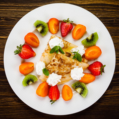 Crepes with fruit and creme