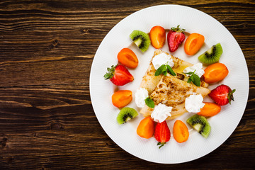 Crepes with fruit and creme