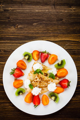 Crepes with fruit and creme