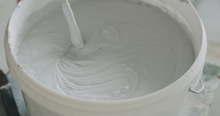 closeup mixing gray decorative concrete plaster