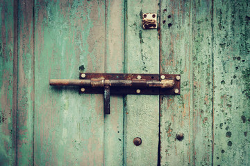 grunge green wooden door knob background and texture