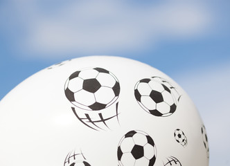 Fototapeta na wymiar balloon with footballs against blue sky - soccer supporter - world cup