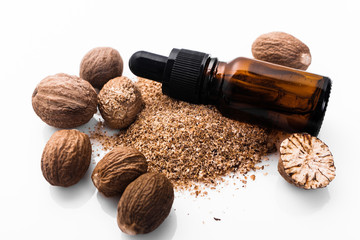 nutmeg essential oil on a white acrylic background